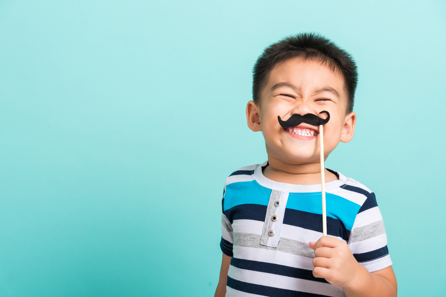 Funny Happy Hipster Kid Holding Mustache