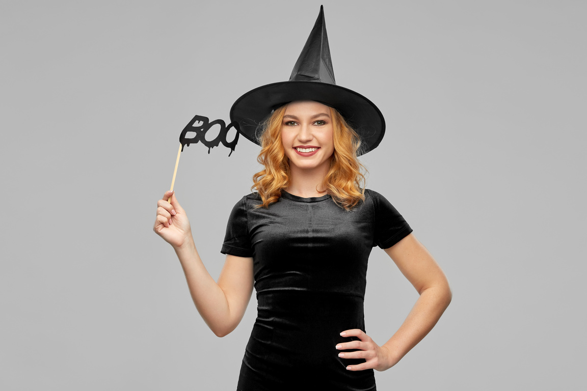 Woman in Halloween Costume of Witch with Accessory